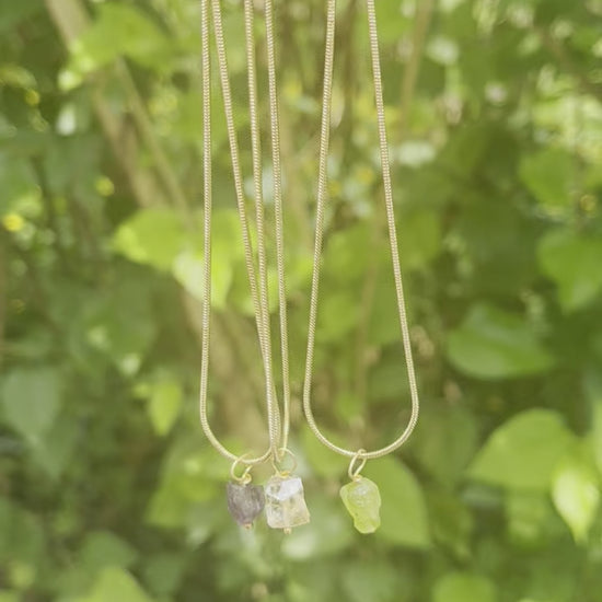 Peridot necklace featuring a sparkling green gemstone pendant on a delicate chain