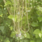Peridot necklace featuring a sparkling green gemstone pendant on a delicate chain