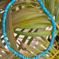Turquoise necklace featuring vibrant blue stones